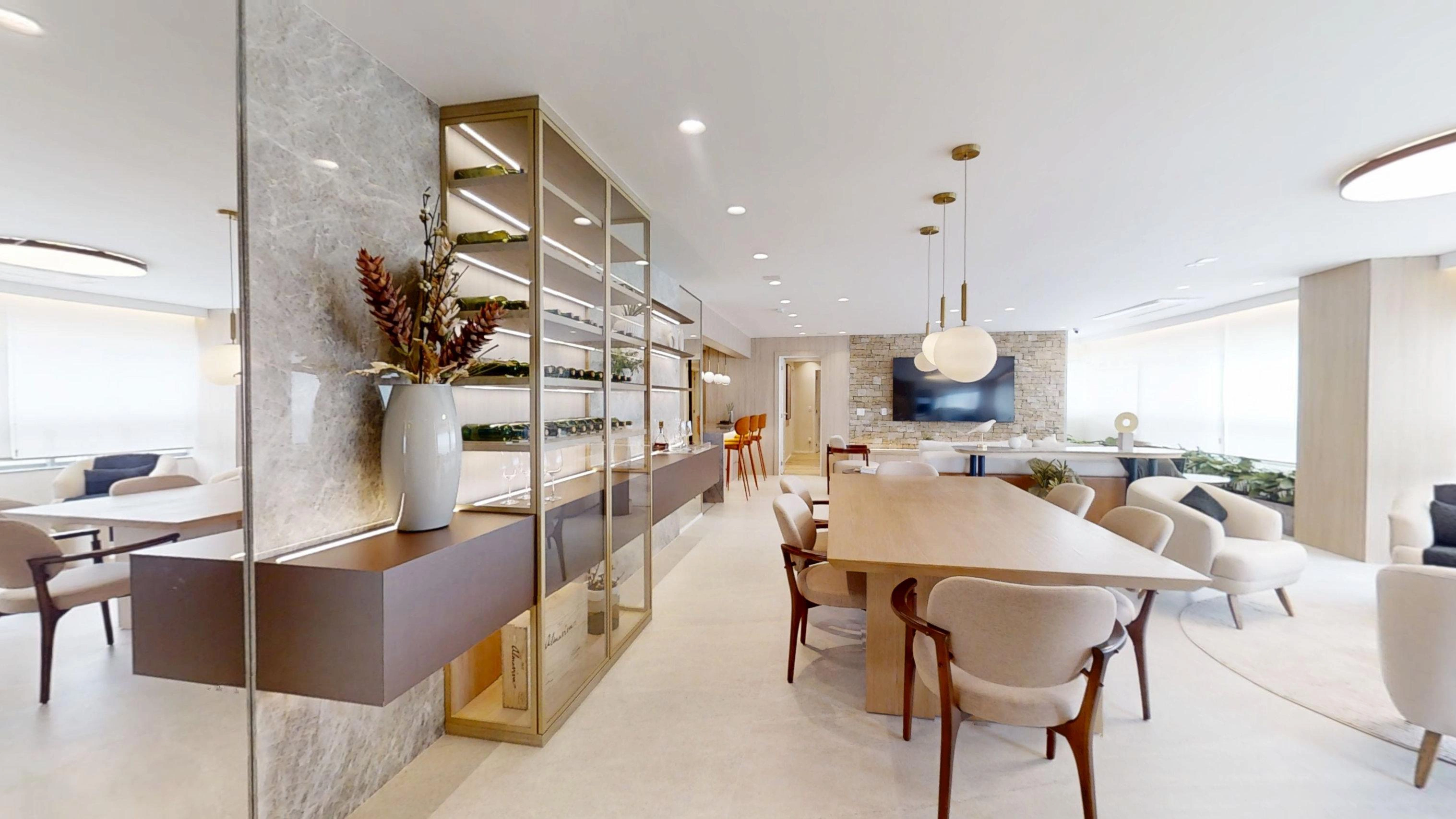 Sala de jantar integrada ao espaço gourmet e ao living do AYA Home